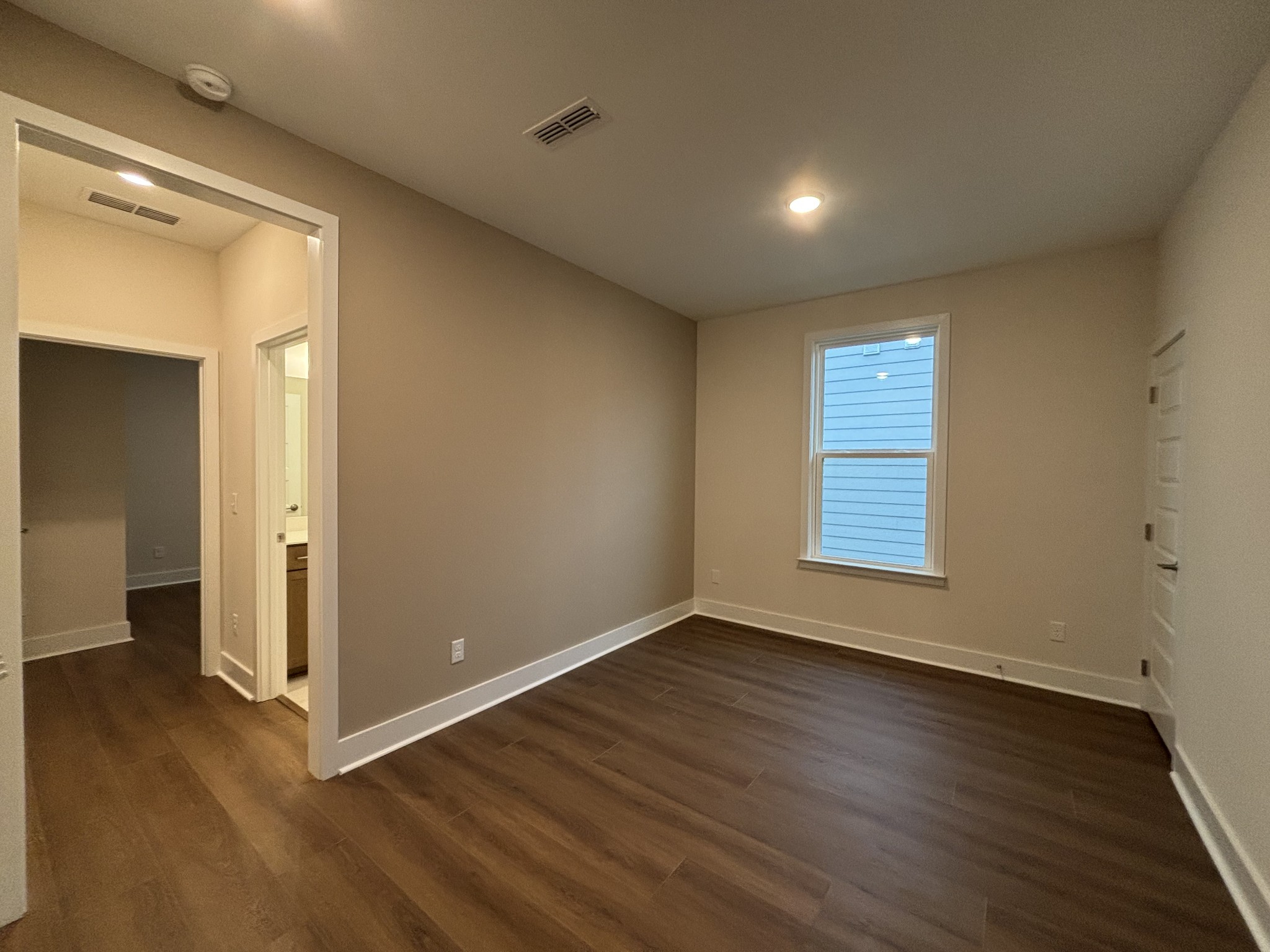 537 Scarlet Oak Road Lebanon, TN 37090 - Photo 19 of 38 a view of an empty room with wooden floor and a window