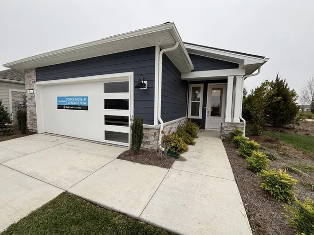 a view of a house with a small yard