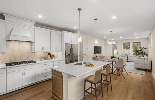 front view of house with a chairs and table in a patio