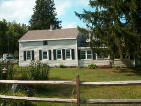 59 Squirrel Island Road Wareham, MA 02576 - Photo 1 of 4 a view of a house with backyard swimming pool and sitting area