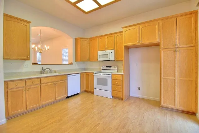 a large kitchen with a window