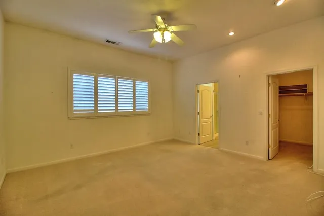 a view of an empty room with a bathroom