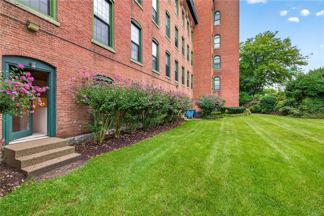 300 Front Street, Unit 101 Pawtucket, RI 02860 - Photo 22 of 27 Outdoor Garden Area showing door to unit with direct access to Garden