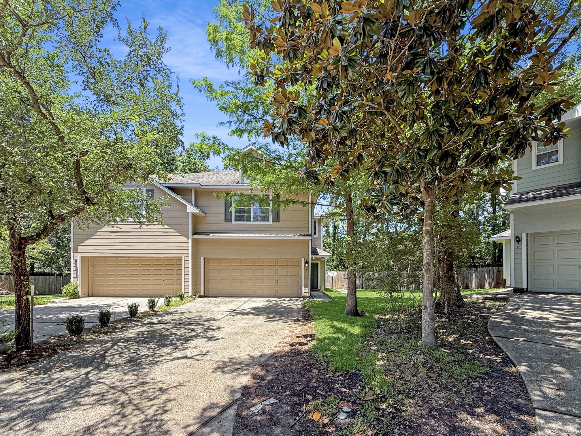 3 Peach Ridge Place The Woodlands, TX 77382 - Photo 1 of 22 a front view of a house with a garden