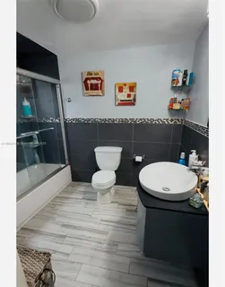 a bathroom with a toilet a sink and a bathtub