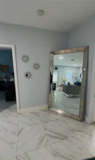 a view of a hallway view with staircase