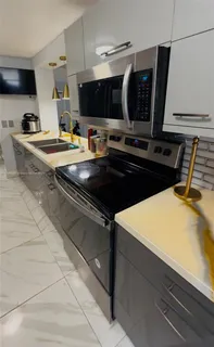 a kitchen with a sink and a stove