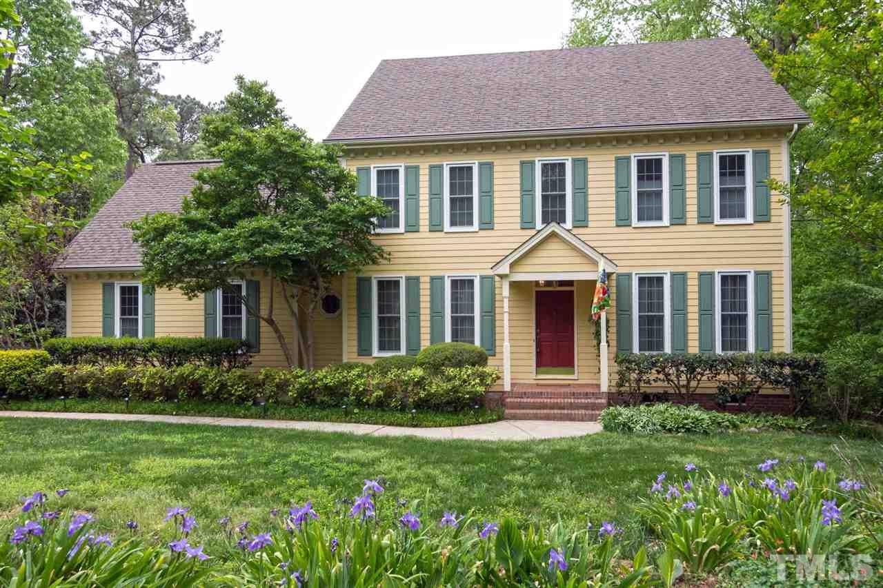 6104 Hampton Ridge Road Raleigh, NC 27603 - Photo 1 of 23 a front view of a house with garden