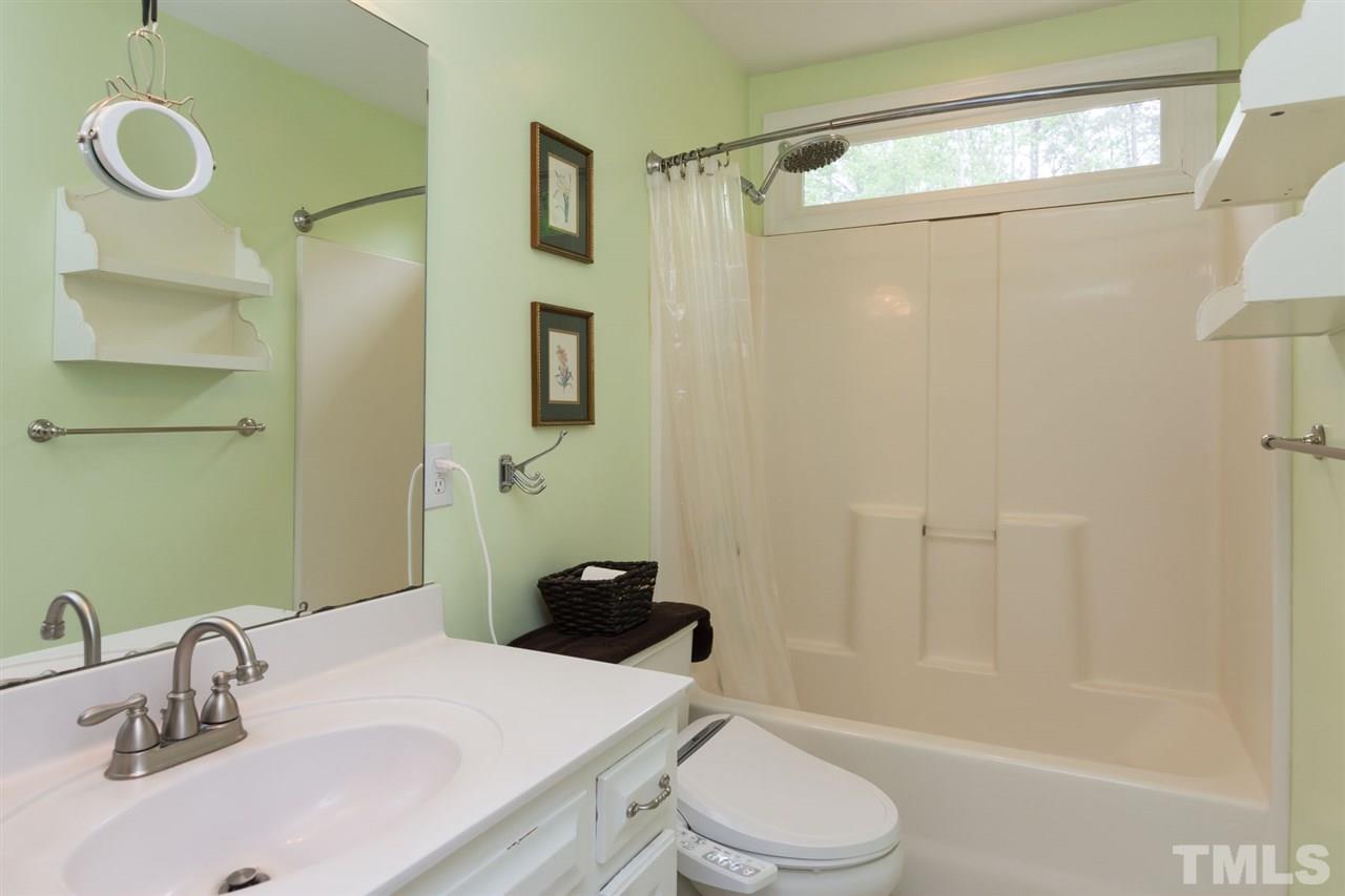 6104 Hampton Ridge Road Raleigh, NC 27603 - Photo 15 of 23 a bathroom with a sink toilet and shower