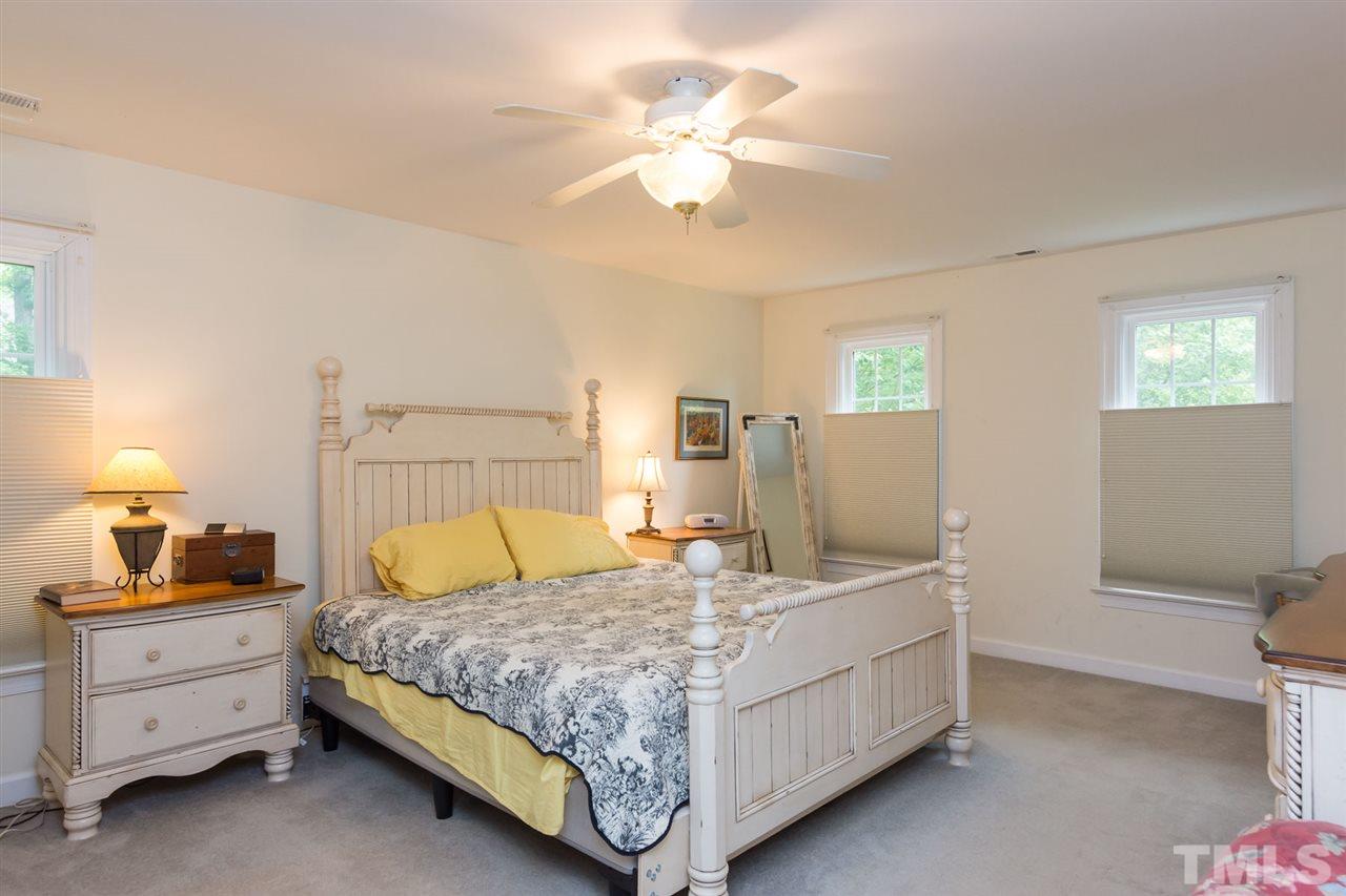 6104 Hampton Ridge Road Raleigh, NC 27603 - Photo 16 of 23 a bedroom with a bed and a dresser