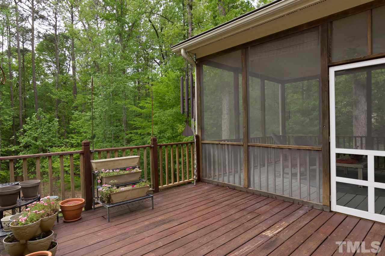 6104 Hampton Ridge Road Raleigh, NC 27603 - Photo 21 of 23 a view of backyard with deck and wooden floor