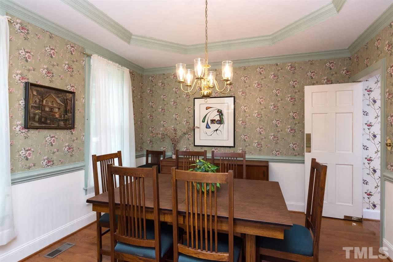 6104 Hampton Ridge Road Raleigh, NC 27603 - Photo 4 of 23 a view of a dining room with furniture window and wooden floor