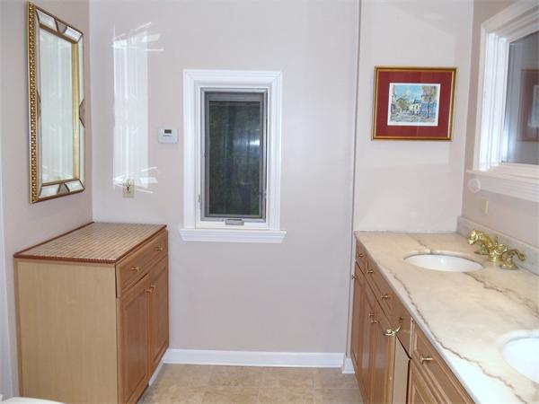 12 Boyce Farm Road Lincoln, MA 01773 - Photo 11 of 30 a bathroom with a sink a vanity and a mirror