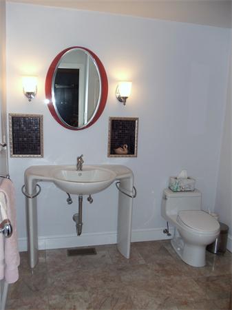 12 Boyce Farm Road Lincoln, MA 01773 - Photo 16 of 30 a bathroom with a toilet a sink and a mirror