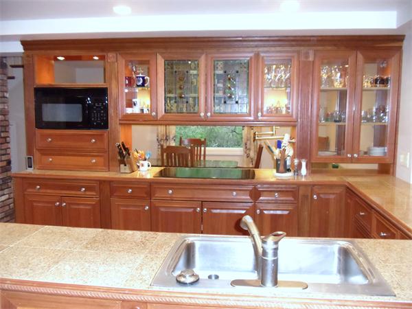 12 Boyce Farm Road Lincoln, MA 01773 - Photo 2 of 30 a kitchen with a sink and large mirror of cabinets