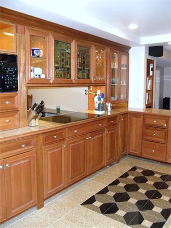 12 Boyce Farm Road Lincoln, MA 01773 - Photo 4 of 30 a kitchen with a sink and wooden cabinets