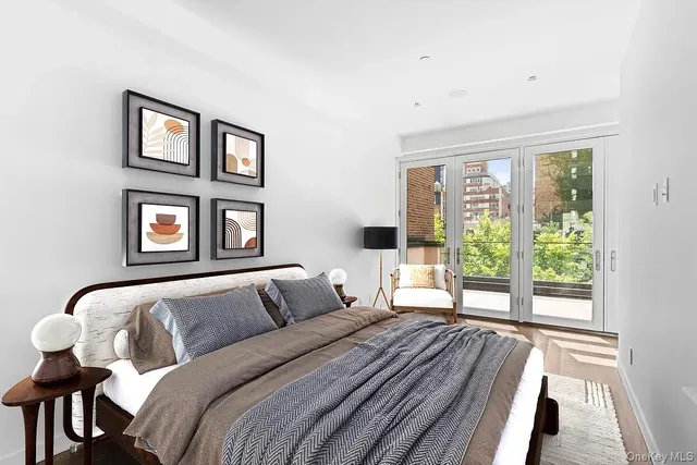 a view of a balcony with wooden floor and outdoor seating