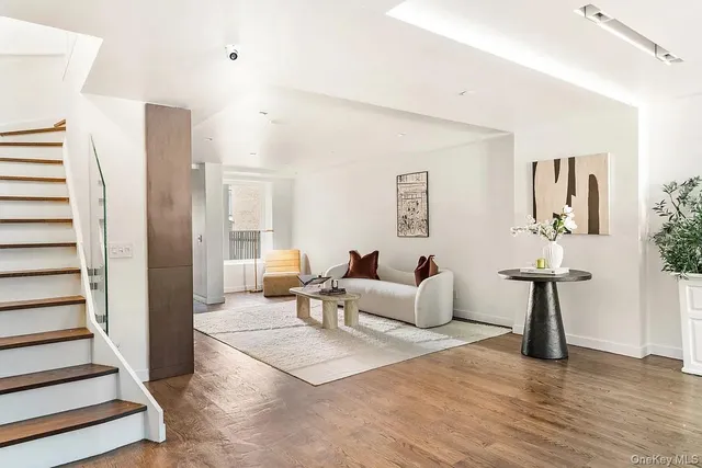 a dining room with furniture and wooden floor