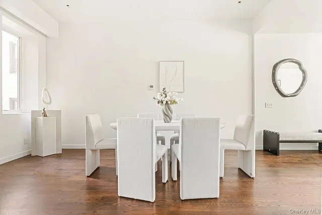 a view of a livingroom with furniture and wooden floor