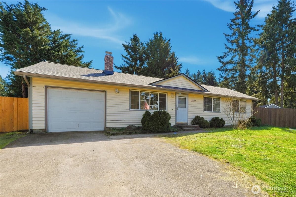 25530 150th Place Southeast Covington, WA 98042 - Photo 1 of 23 a front view of a house with a yard and garage