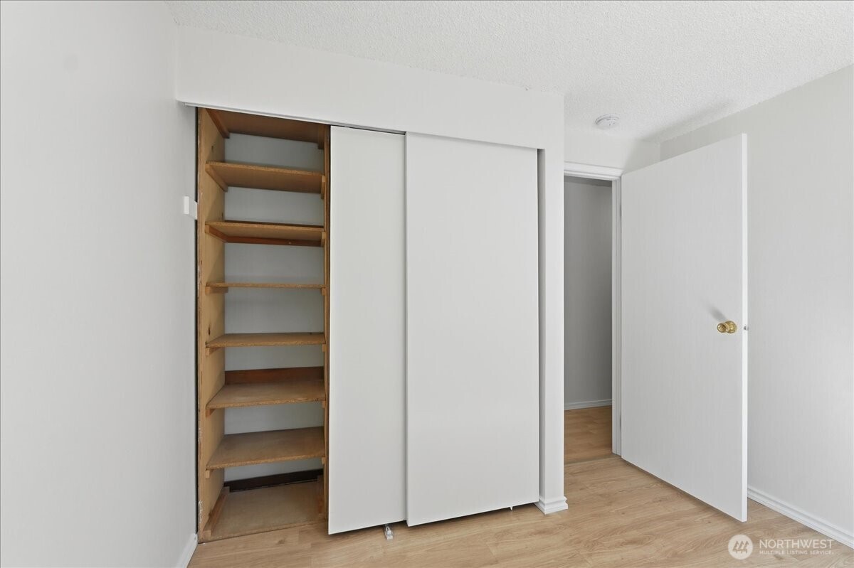 25530 150th Place Southeast Covington, WA 98042 - Photo 12 of 23 a view of walk in closet with empty racks