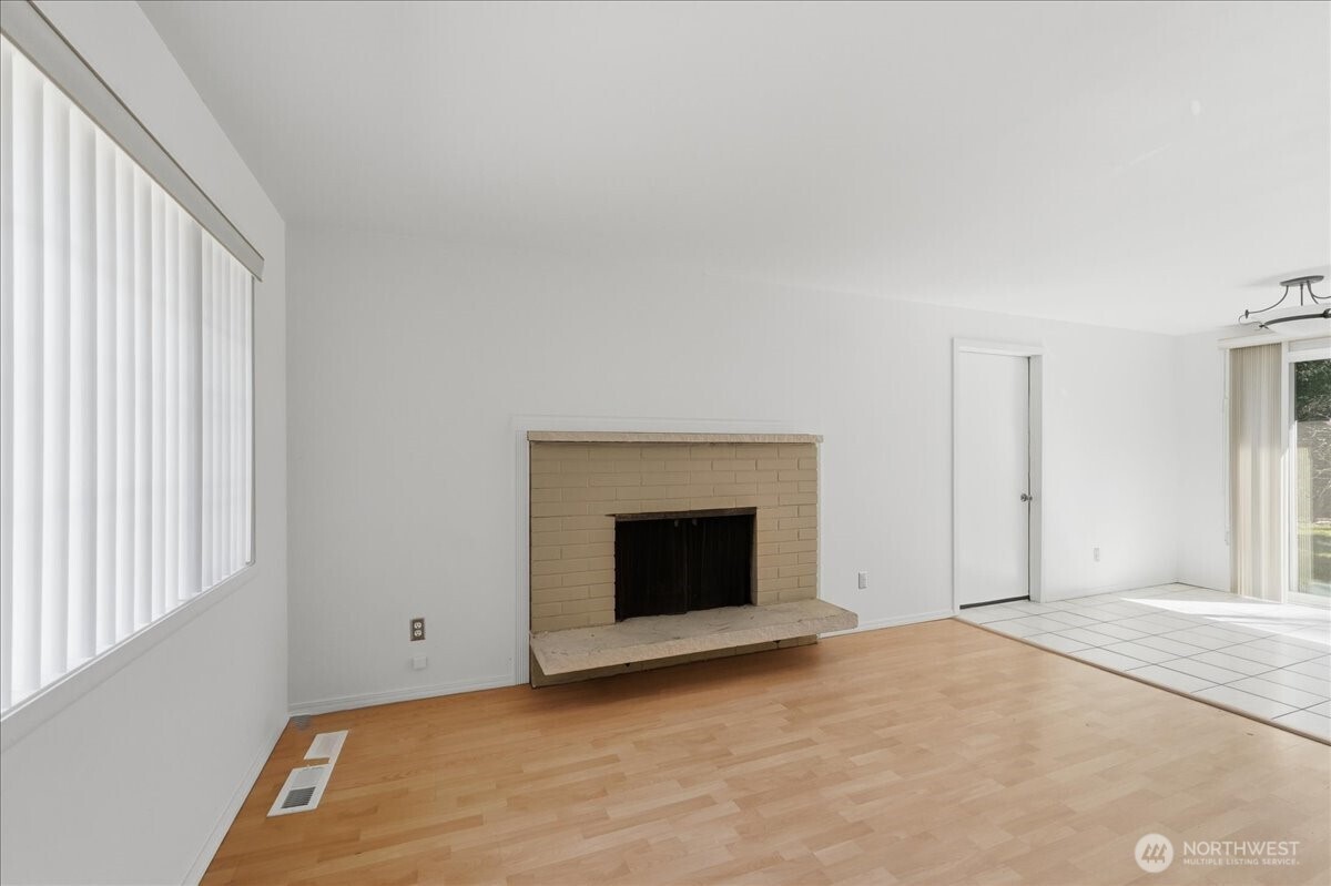 25530 150th Place Southeast Covington, WA 98042 - Photo 3 of 23 a view of an empty room with window and fire place