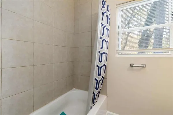 a bath tub sitting next to a window