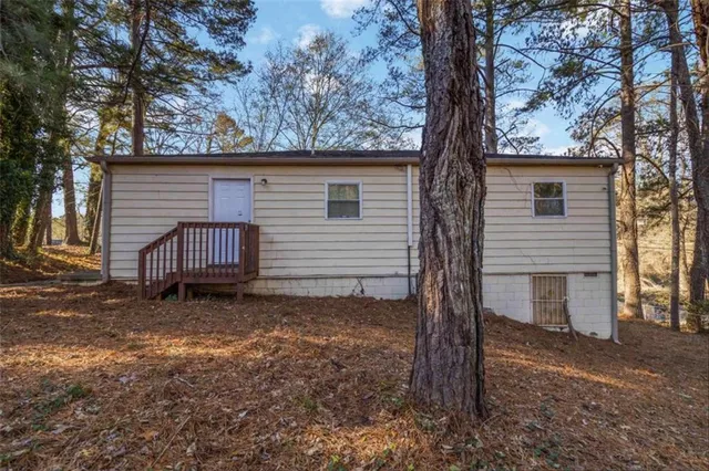 a house view with a backyard space