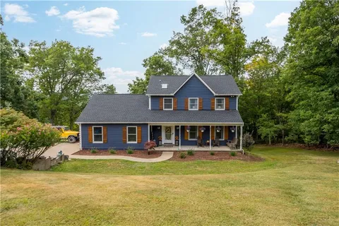 a front view of a house with swimming pool