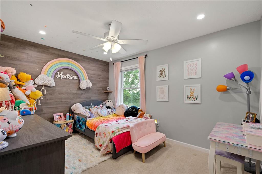 555 Hiawatha Road Prosperity, PA 15329 - Photo 24 of 40 a bedroom with a bed and a chandelier