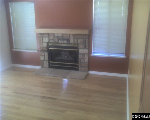 6319 Chesterfield Lane Reno, NV 89523 - Photo 6 of 8 a living room with a fireplace