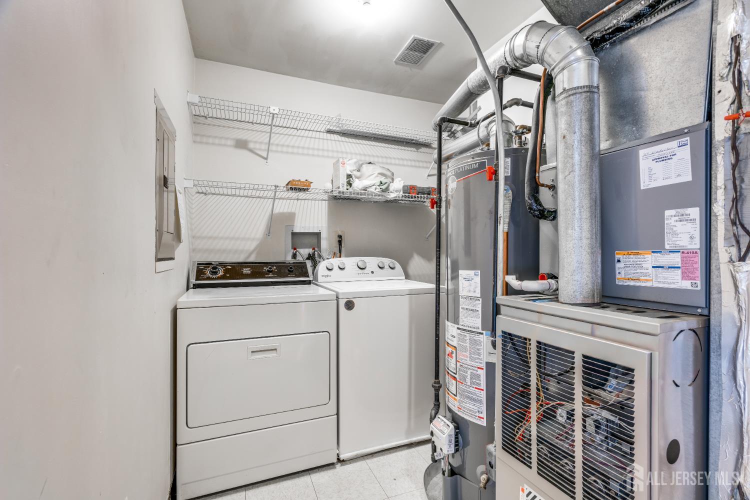 304 Wimbeldon Court North Brunswick, NJ 08902 - Photo 12 of 19 a utility room with dryer and washer