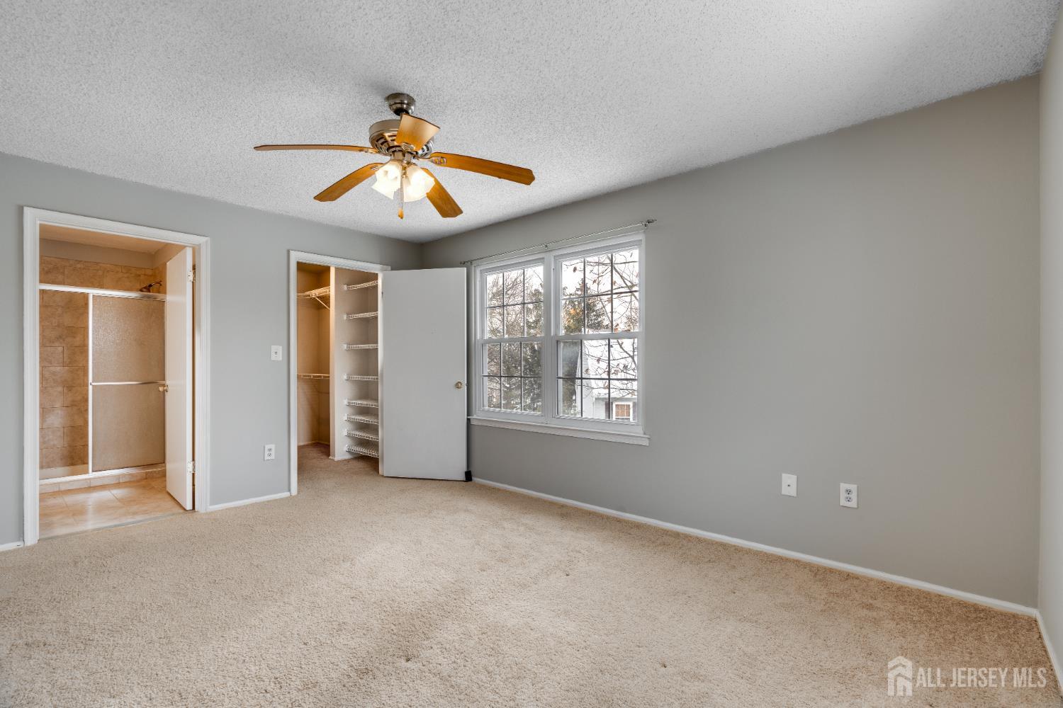 304 Wimbeldon Court North Brunswick, NJ 08902 - Photo 10 of 19 wooden floor in an empty room with a window