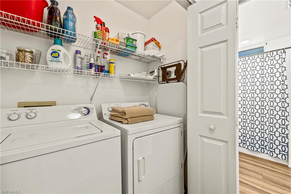 280 Robin Hood Circle, Unit 101 Naples, FL 34104 - Photo 19 of 19 a utility room with dryer and washer