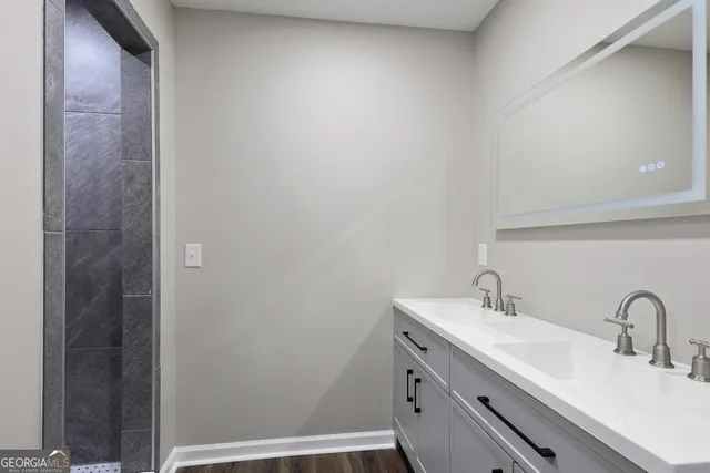 a bathroom with a sink and a mirror