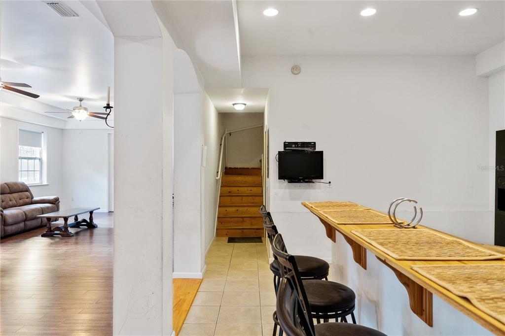 16295 Highway 40 Ocala, FL 34481 - Photo 14 of 39 a hallway with a view of living room and wooden floor