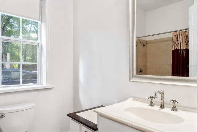a bathroom with a shower and a glass door