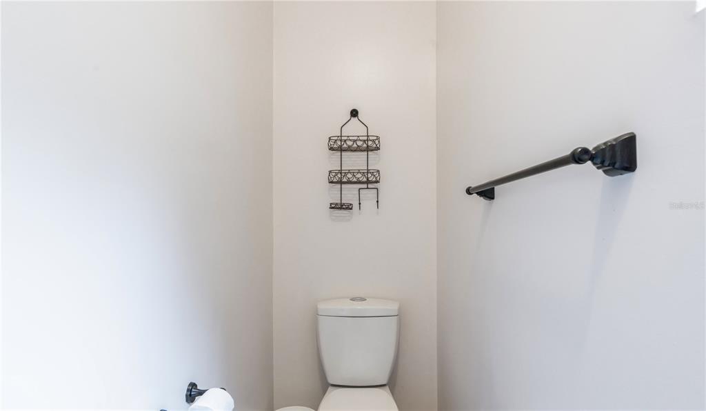 16295 Highway 40 Ocala, FL 34481 - Photo 23 of 39 a bathroom with a toilet and a shower curtain