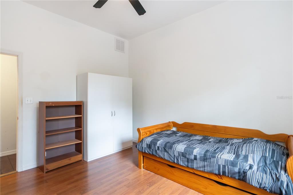 16295 Highway 40 Ocala, FL 34481 - Photo 27 of 39 a bedroom with a bed and hardwood floor