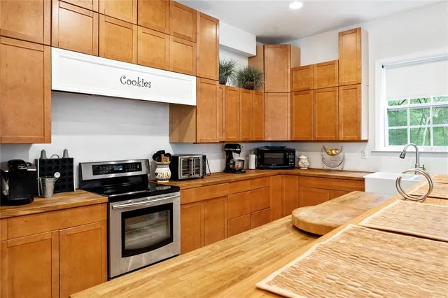 a kitchen that has a table and chairs in it