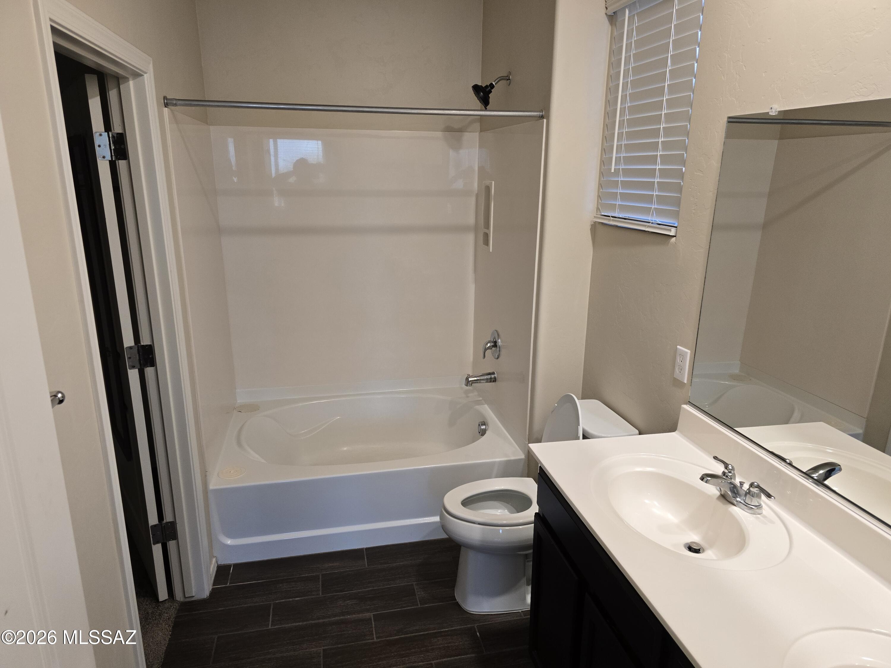 6151 South Antrim Loop Tucson, AZ 85706 - Photo 8 of 13 a bathroom with a sink toilet and shower