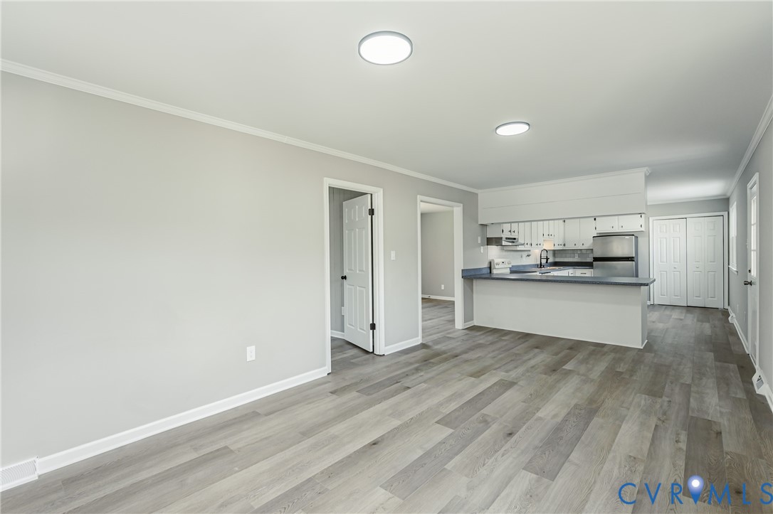 15412 Exter Mill Road Chesterfield, VA 23838 - Photo 31 of 66 Unfurnished living room featuring ornamental moldi