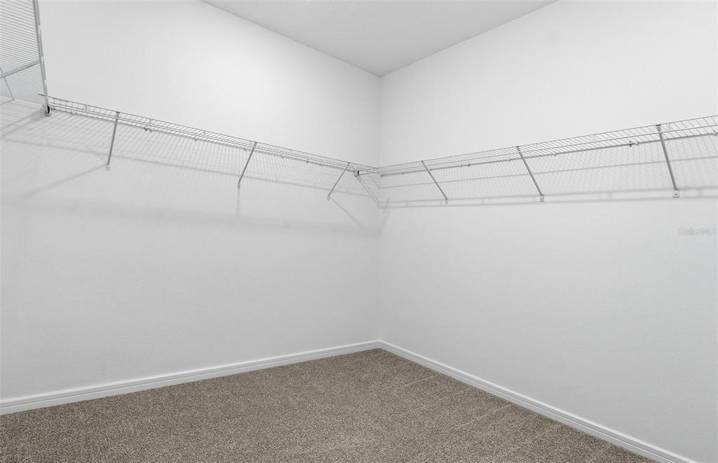 8339 Southwest 58 Loop Ocala, FL 34481 - Photo 11 of 35 a view of a room with racks on the wall
