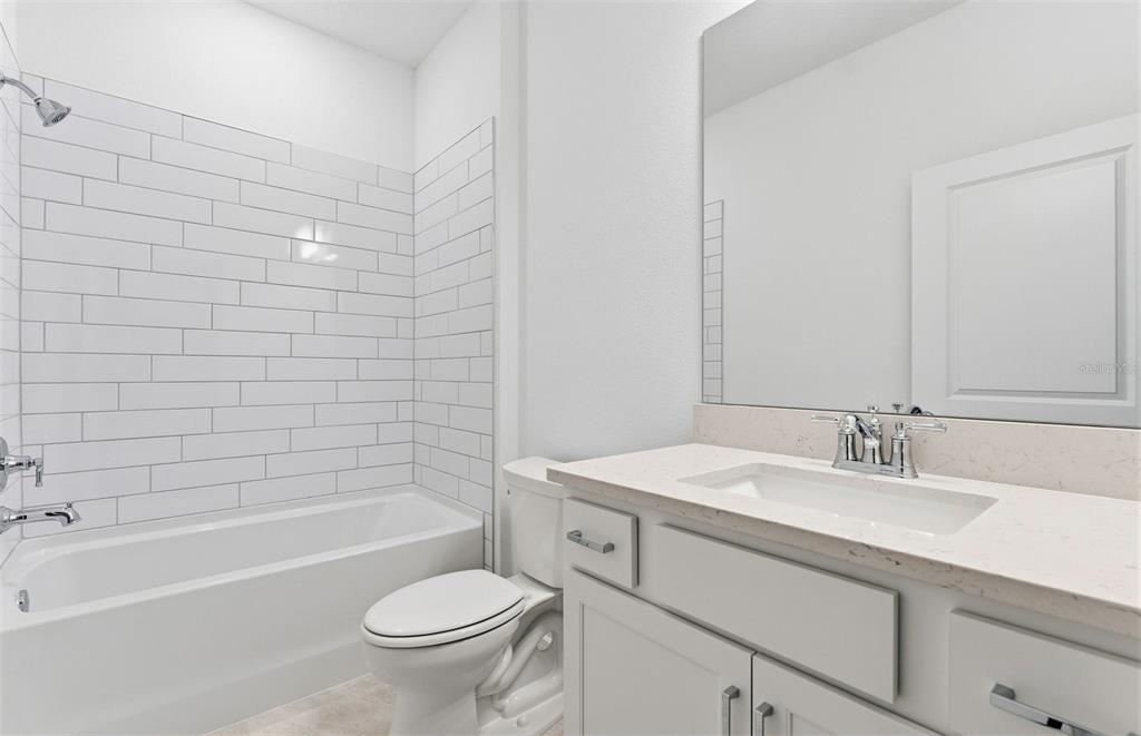 8339 Southwest 58 Loop Ocala, FL 34481 - Photo 13 of 35 a bathroom with a sink a toilet and shower