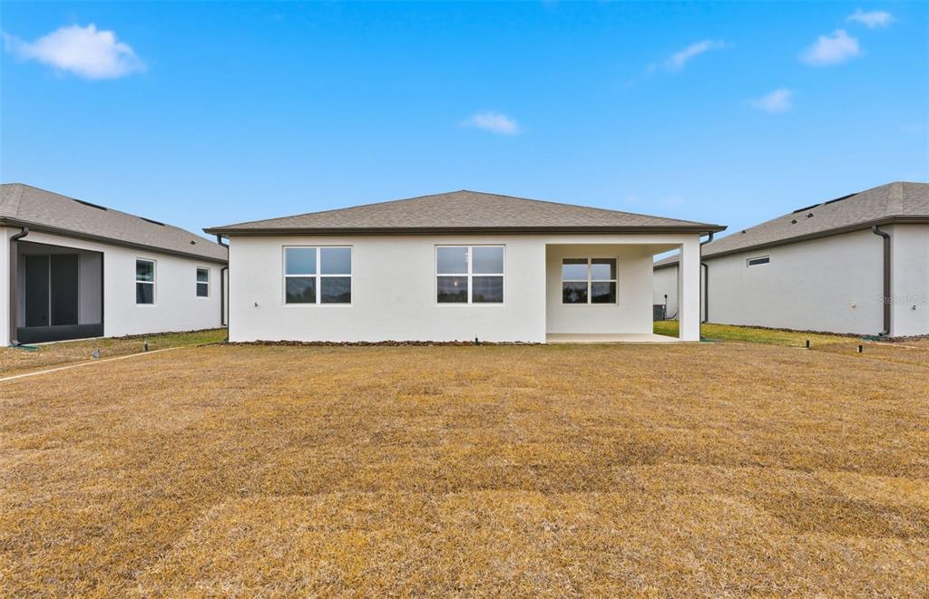 8339 Southwest 58 Loop Ocala, FL 34481 - Photo 16 of 35 a view of an house with backyard