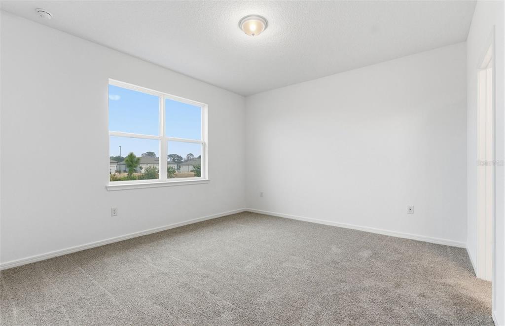 8339 Southwest 58 Loop Ocala, FL 34481 - Photo 8 of 35 an empty room with windows