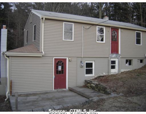 8 Robbins Road Hampton, CT 06247 - Photo 1 of 1 a view of a house with a backyard