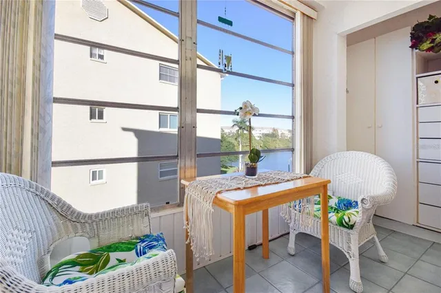 a dining room with furniture and a window