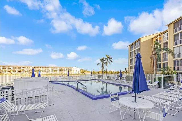 a view of a balcony with furniture