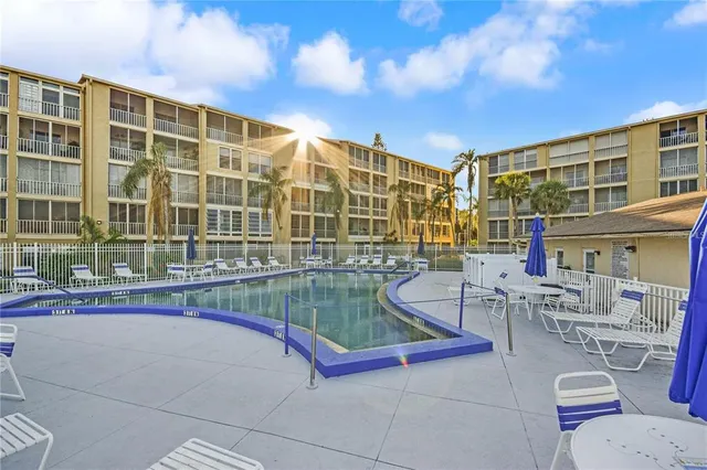 a view of pool with outdoor seating